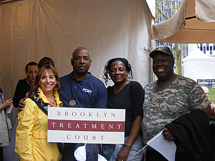 group shot with Brooklyn Treatment Court sign