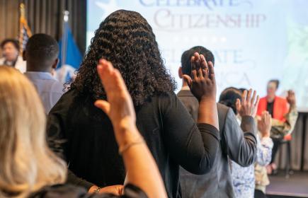 Image of People taking citizenship oath