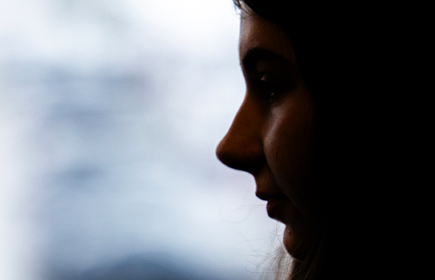 Photo of a young girls face in silhouette 