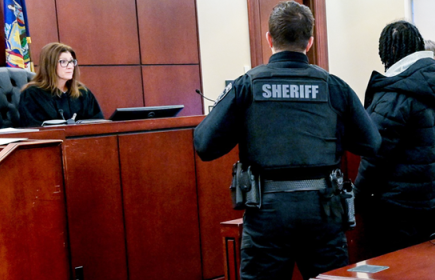 Photo of a judge, sheriff, and juvenile delinquent