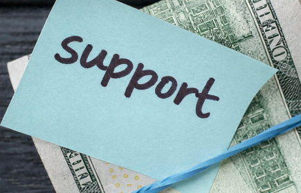 Money with post-it labled Support