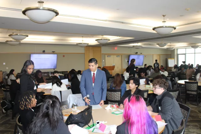 PDI staff and students around a table
