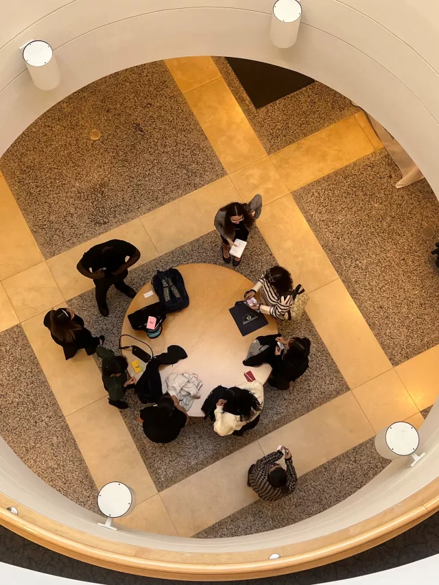 A PDI fellow talks with students
