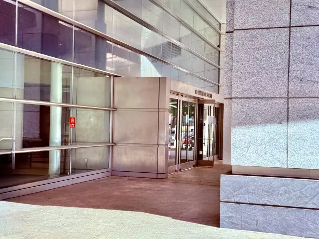 An angled view of the ADA-accessible entrance is pictured. Enter directly from street level. There are multiple entrance doors.
