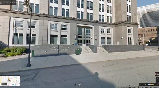 Description of photo: The main entrance of Erie Family Court. An ADA-accessible ramp located to the right of the building.