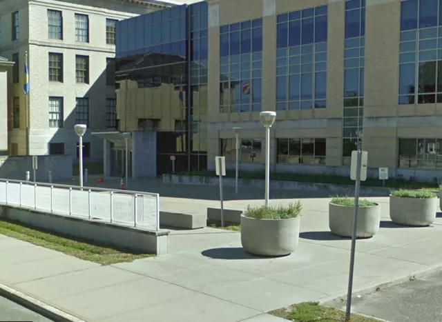 A large walkway to the entrance to the court facility.