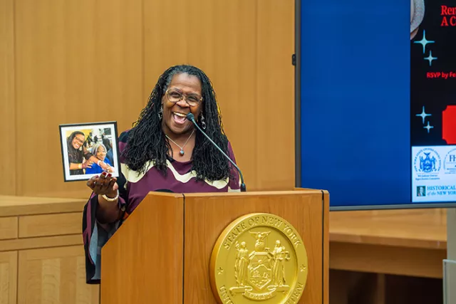 Photo: Deputy Chief Administrative Judge for Justice Initiatives Edwina G. Richardson proudly displays a photograph of her 101-year-old maternal aunt, Dr. Gloria Lindsay Hobbs, during the Westchester courthouse event, noting that her middle initial “G” is a tribute to her aunt’s legacy and influence 