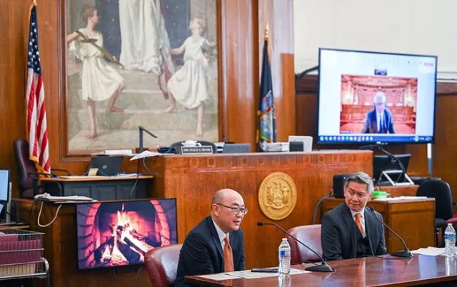 Retired Appellate Division, First Department Associate Justice Jeffrey K. Oing (left) and Acting New York County Supreme Court Justice Christopher Chin spoke in person at the Lower Manhattan fireside chat, while retired Appellate Division, First Department Associate Justice Anil C. Singh (pictured on screen) participated remotely 