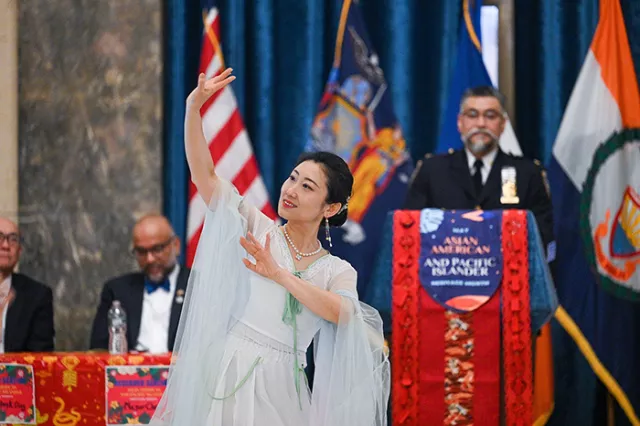 Queens County Supreme Court-Civil Term Network Systems Technician Helen Zhu graces the crowd with a traditional Chinese dance performance 