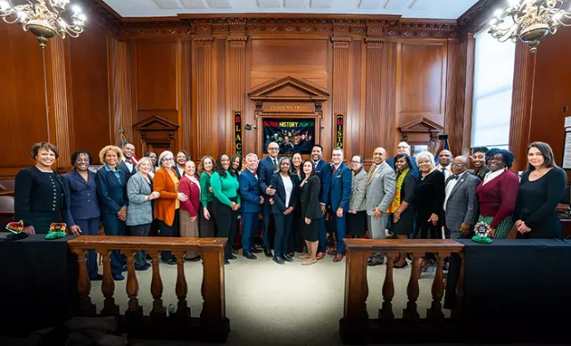 Photo: Members of the court community gather with locals for a commemorative photo, marking the thought-provoking courthouse event held in early February in celebration of Black History Month 