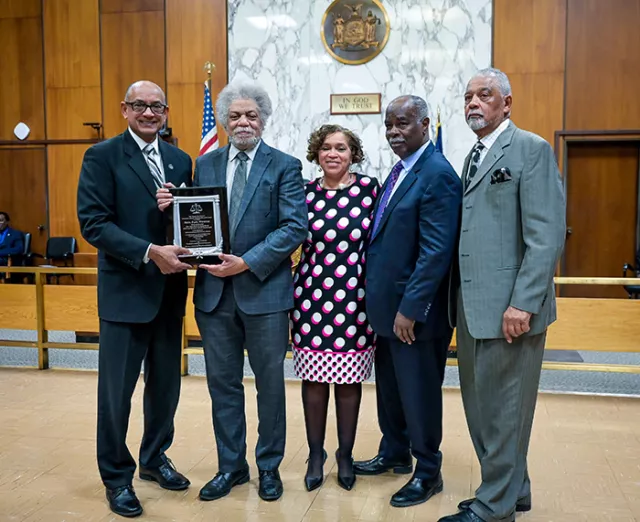 First Deputy Chief Administrative Judge Norman St. George (left) presents Appellate Division, Second Dept. Associate Justice Paul Wooten with the Hon. Alfred S. Robbins Memorial Award during the Nassau County Courts’ 21st Annual Black History Program at Nassau County Supreme Court. Charmaine Cooper, Secretary to Nassau County Acting Supreme Court Justice Nancy Nicotra (center) earned the Michele M. Woodward Service Award. Also pictured are former Nassau County Court Judge Jerald S. Carter (second from right