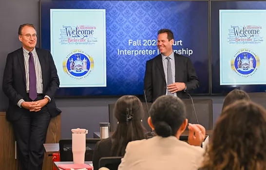 Photo of people sitting in a conference room for a Court Interpreter Internship program.