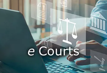 Photo of man typing on a laptop with screen showing scales of justice and the word e-Courts