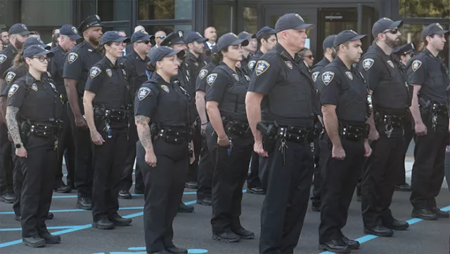  Photo: Suffolk County court officers stand at attention on the 24-year anniversary of the tragic events of 9/11