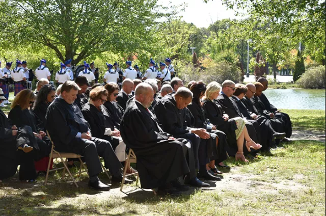 Photo: Suffolk County Court judges bow their heads in a moment of silence for the many victims and heroes of 9/11, among them the court system’s Captain William Harry Thompson and Sgts. Thomas Jurgens and Mitchel Wallace 