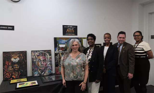  Islip Arts Council President Linda Weingarten, Principal Law Clerk Patricia Waite, Supervising Judge of Suffolk County Supreme Court’s Matrimonial Parts Cheryl Joseph, guest lecturer Rudy Carmenaty, and Suffolk County Family Court Attorney-Referee Darlene Jorif-Mangane kick off Black History Month with a powerful tribute to boxing legend Muhammad Ali, the first in a series of BHM programs hosted by the Suffolk County Courts 