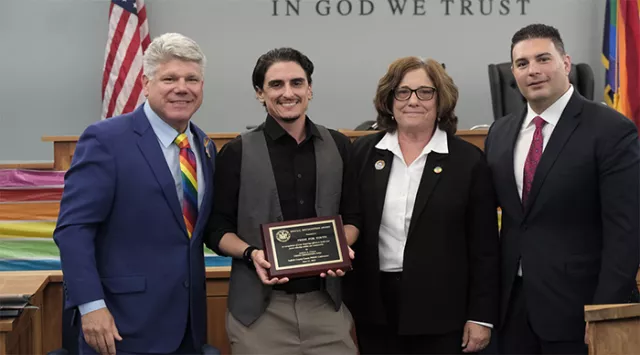 Administrative Judge Crecca, awardee Devon Zappasodi of Pride for Youth, Acting Supreme Court Justice Kelley, and attorney Christopher Chimera celebrate PRIDE month at the Cohalan Court Complex in Central Islip, Long Island 