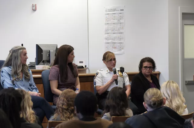 Photo: Sergeant Evelyn Portes (second from right) talks about her work as a member of the court system’s corps of uniformed officers at the Suffolk County Courts’ Women’s History Month kickoff event, where over 100 young women from local high schools learned about the range of career opportunities available within the New York State Courts. Court Attorney-Referee Julie Walsh is pictured far left, Deputy Chief Clerk of County Court Rachel Landkammer is seated to Sgt. Portes’s left, and Principal Court Interp
