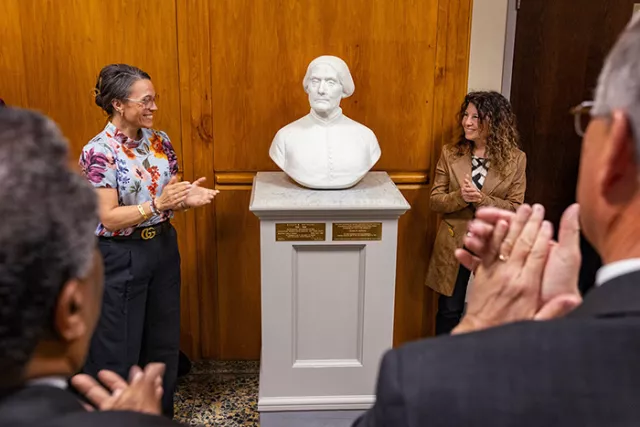 Auburn City Court Judge Kristin Garland and Associate Court Attorney Laurie Michelman unveil a statue of Susan B. Anthony at the Monroe County Hall of Justice’s dedication ceremony in Rochester in late March 