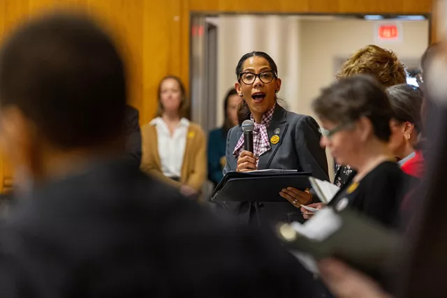 Rochester City Court Melissa Barrett reads a quote from Susan B. Anthony during the March 25th courtroom dedication ceremony at the Rochester courthouse 