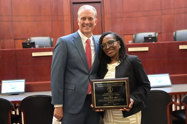 Photo (L-R): Seventh Judicial District Administrative Judge William K. Taylor and honoree Monroe County Family Court Judge Fatimat O. Reid, who was recently awarded the Appellate Division, Fourth Department’s prestigious Hon. Shirley Troutman Award for Excellence in DEI 