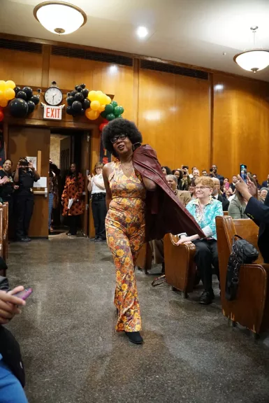 Queens County Supreme-Criminal Senior Court Reporter Angela Moody channels the disco era at the Kew Gardens court's Black fashion show 