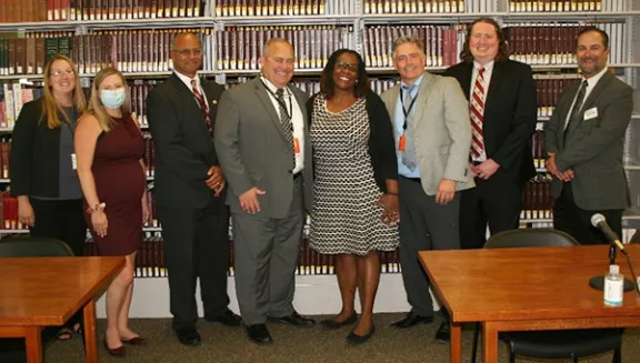 Left to Right: Amanda Whalen-Garnar, Deputy District Executive; Sadie Harrison, Senior Court Analyst/Access to Justice Liaison; Porter L. Kirkwood, Esq., District Executive; Hon. Eugene D. Faughnan, Sixth Judicial District Administrative Judge; Hon. Edwina Richardson, DCAJ for Justice Initiatives; Dan Fitzsimmons, Esq., Court Attorney Referee; Christopher Lund, Esq., District Law Librarian; Jason Carlton, Esq., Broome County Bar Association President