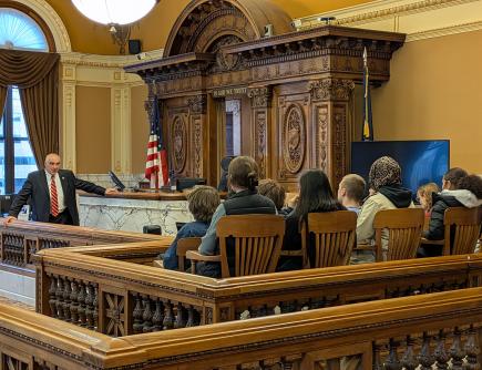 Judge Lamendola speaking to Liverpool HS students