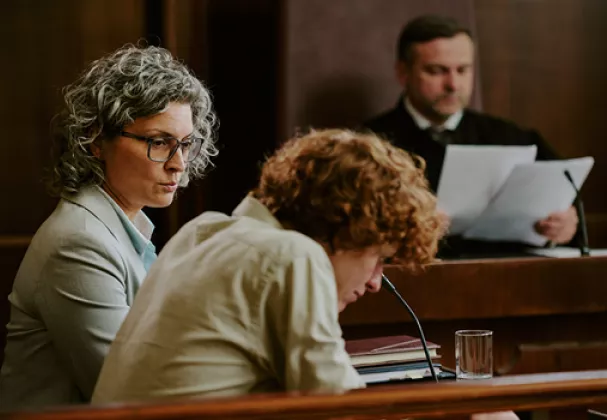 Teenager in court, looks dejected