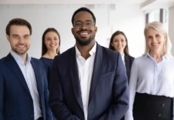 5 Lawyers standing and smiling at the camera