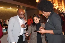 Commission members Shomari Ward, Esq., Piyali Basak, Esq., and Tehra Coles, Esq., compare notes.