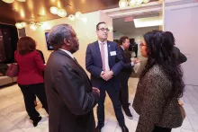 Deputy Chief Administrative Judge for the New York City Courts Adam Silvera speaks with Commission Co-chair and Statewide Coordinating Judge for Family Court Matters Hon. Richard Rivera and Kings County Family Court Judge Hon. Nisha Menon.